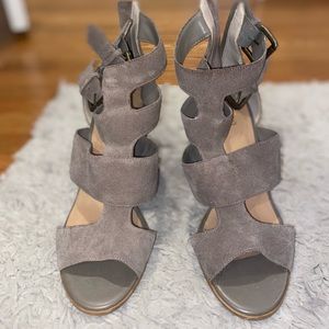 Gray heeled booties with cutouts